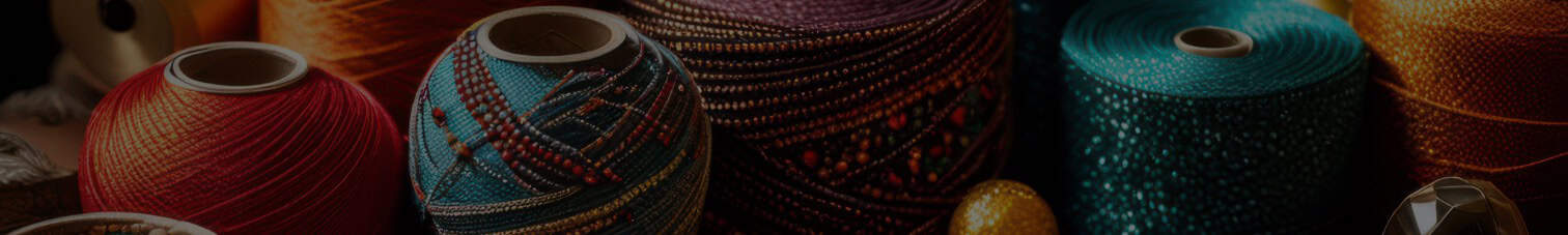 Kente cloth and traditional African textiles displayed in vibrant colors and intricate patterns.