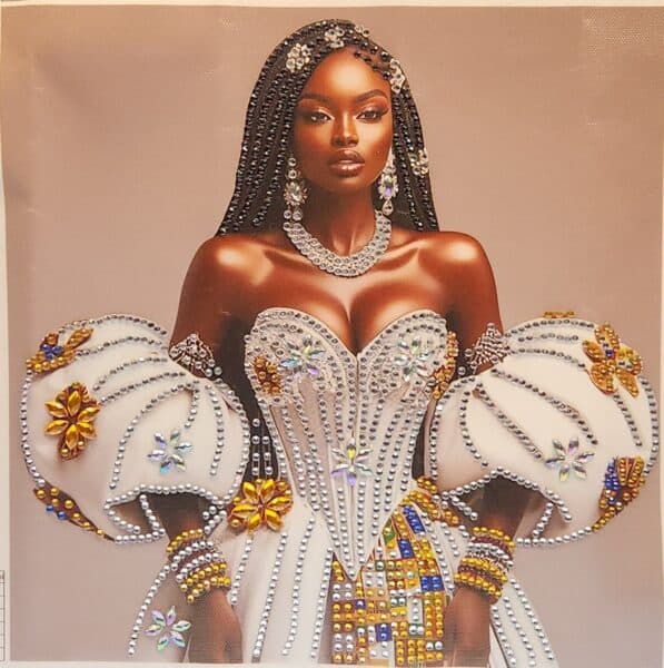 Elegant Black woman in a glamorous, embellished gown with intricate beadwork and floral details, sho.