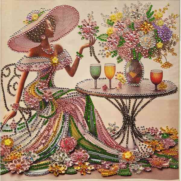 A woman in a floral dress with a large hat, sitting at a table with colorful drinks and a vibrant fl.
