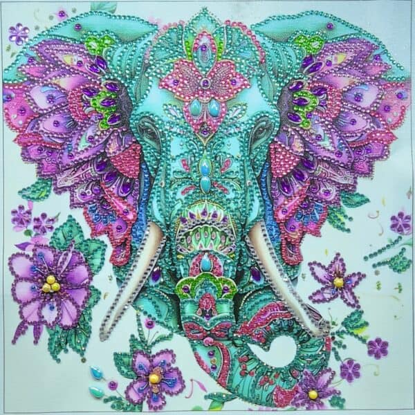 Brightly decorated beaded elephant with floral accents in vibrant purple, pink, and turquoise colors.