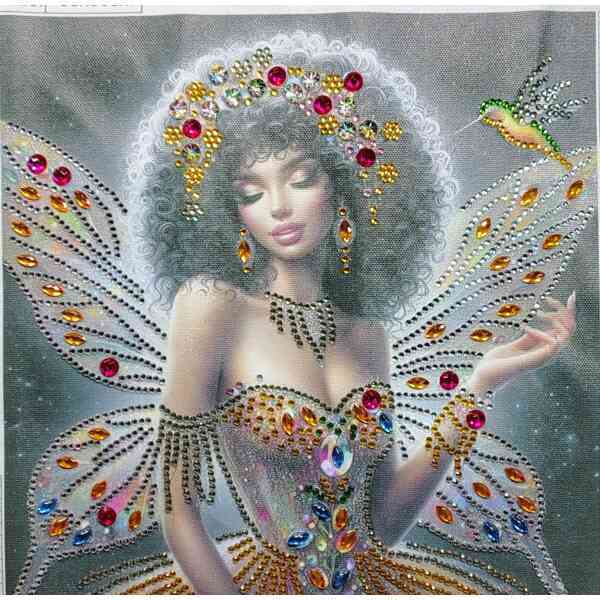 Elegant woman with fairy wings adorned with colorful gemstones and a floral crown, fantasy-inspired.