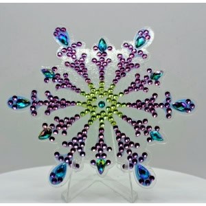 Brightly colored rhinestone snowflake ornament with purple, blue, and green accents for festive deco.