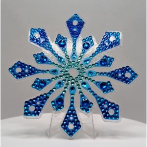 Blue rhinestone snowflake ornament for holiday decor and Black History Month celebrations.