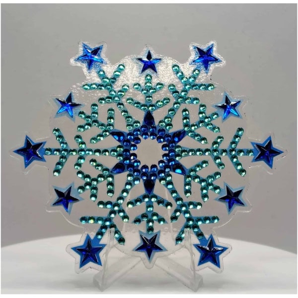 Blue and teal snowflake ornament with star accents, perfect for winter decor and holiday celebration.