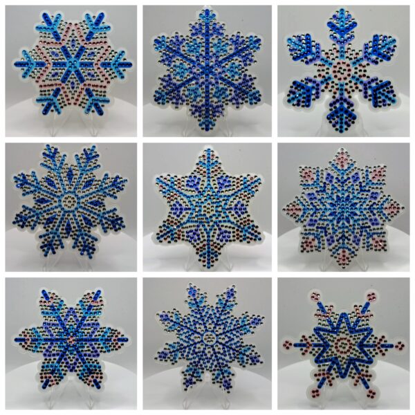Beautiful beaded snowflake ornaments in blue and white for winter decor.