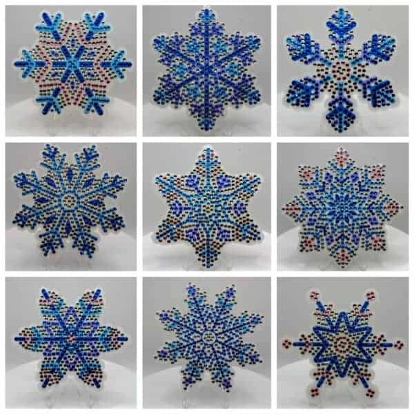 Beautiful beaded snowflake ornaments in blue and white for winter decor.