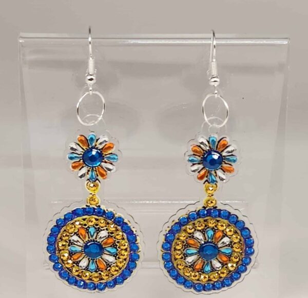 Elegant blue and gold beaded dangle earrings with floral design, perfect for BlackSpace jewelry coll.