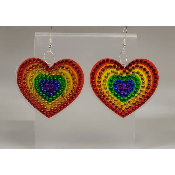 Rainbow heart-shaped earrings with colorful rhinestones, representing pride and diversity.