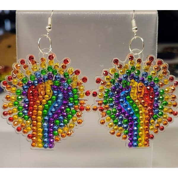 Rainbow beaded earrings with a heart-shaped design, featuring vibrant multicolored rhinestones and s.