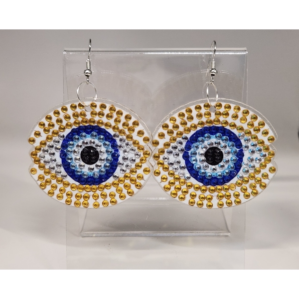 Beaded evil eye earrings with gold and blue accents, handmade jewelry accessory.