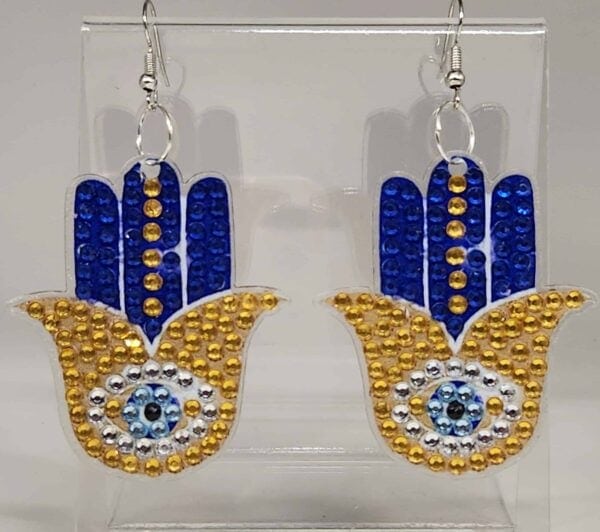 Bright blue and gold beaded earrings inspired by Hamsa symbols, featuring intricate eye designs for.