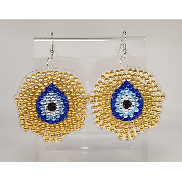 Beaded eye earrings with gold, blue, white, and black beads, handmade jewelry.