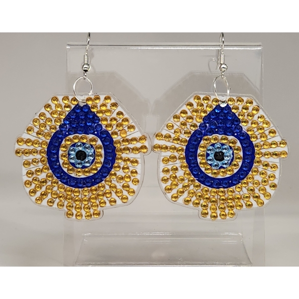 Colorful beaded earrings with blue, gold, and black accents, displayed on a clear stand.