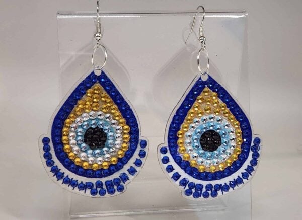 Bright blue, gold, and black beaded earrings with eye-catching design, showcasing vibrant colors and.