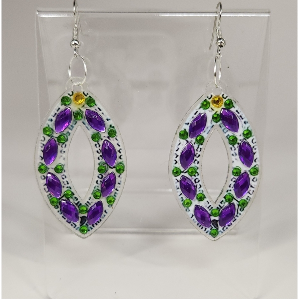 Purple and green beaded earrings with silver hooks, displayed on a clear stand.