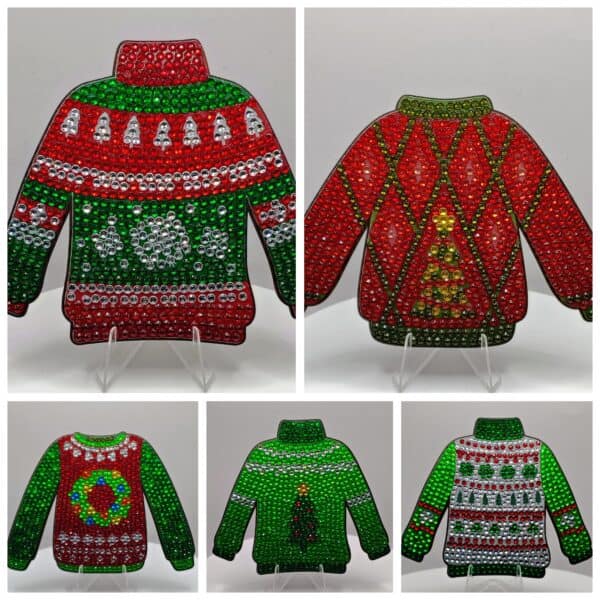 Festive holiday sweater ornaments decorated with colorful rhinestones, featuring Christmas themes an.
