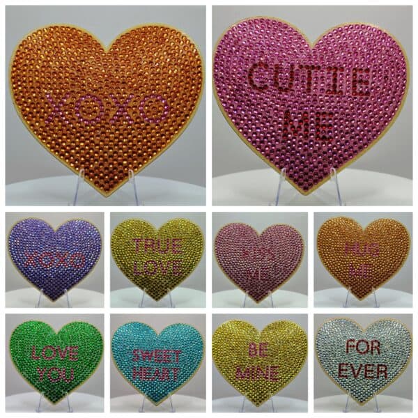 Xoxo and love message heart-shaped decor with rhinestones, vibrant colors, and inspirational phrases.