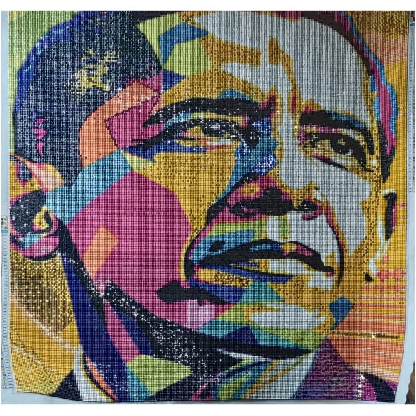 Colorful mosaic portrait of a woman with expressive eyes and a serious expression.